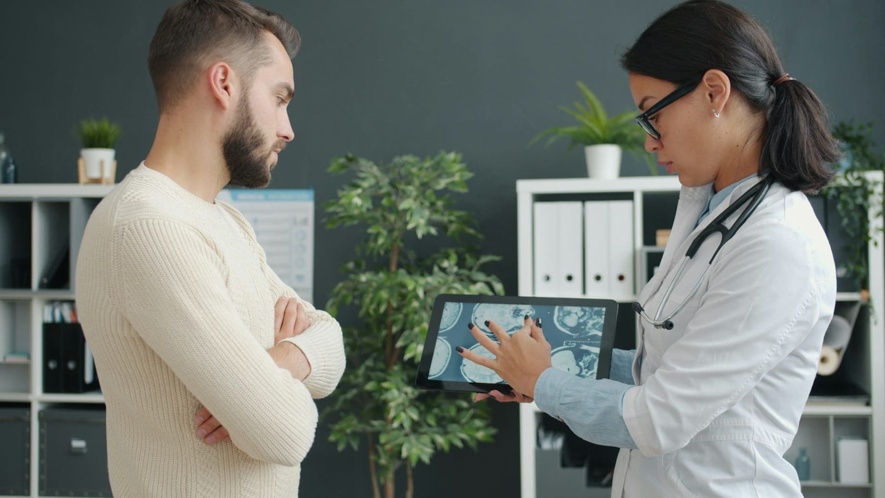Doctor explaining results on a tablet to a patient