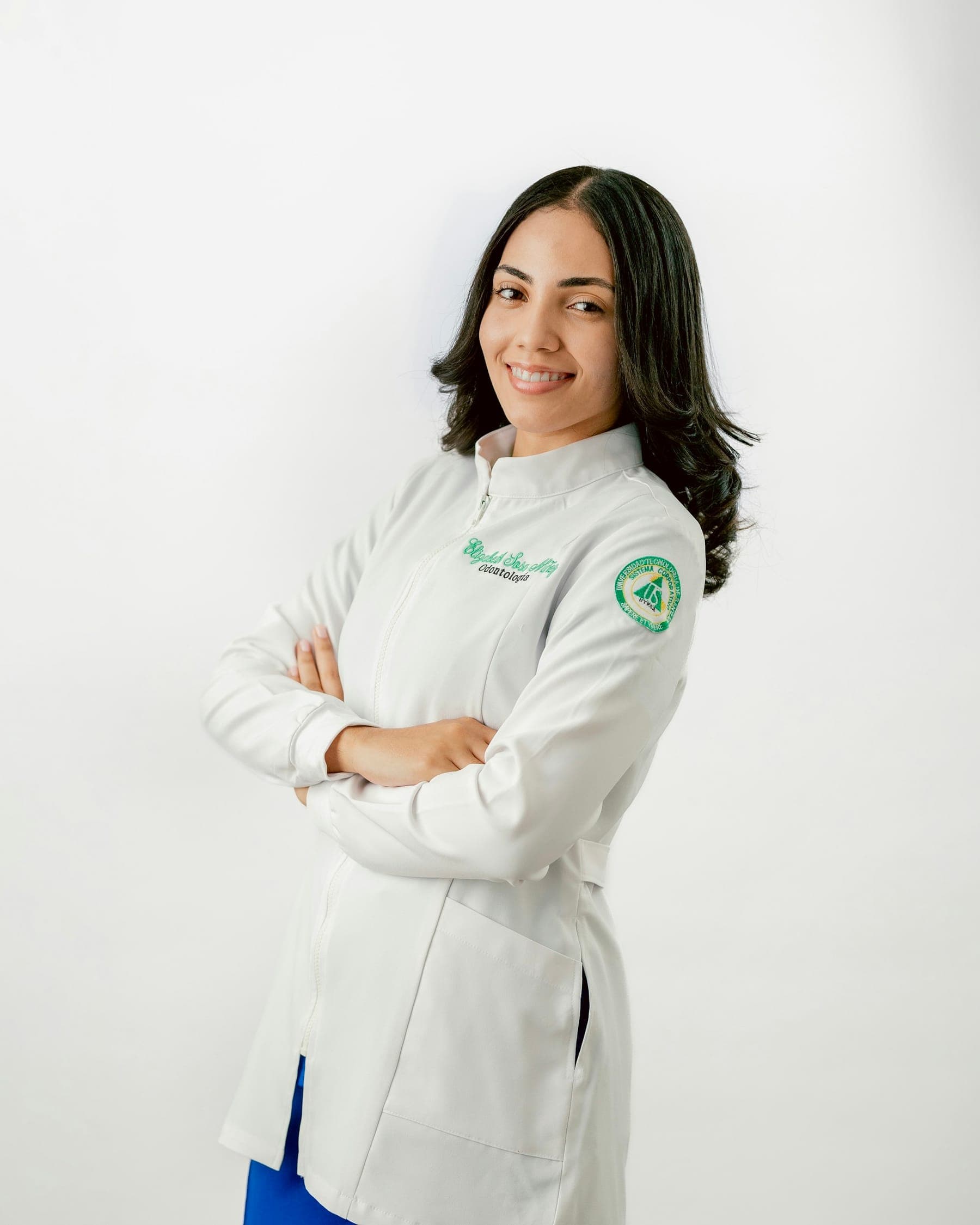Portrait of Dr. Amira Haddad (sample profile) in a white coat